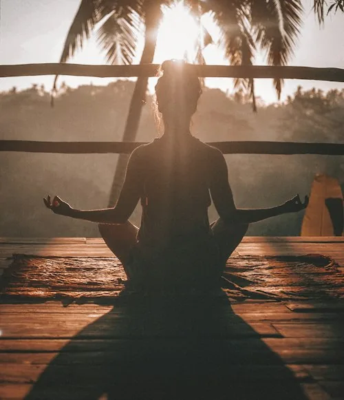 Person sitting quietly in reflection